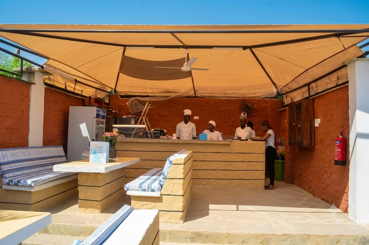 The Splash Kitchen & Bar counter with staff under shaded canopy